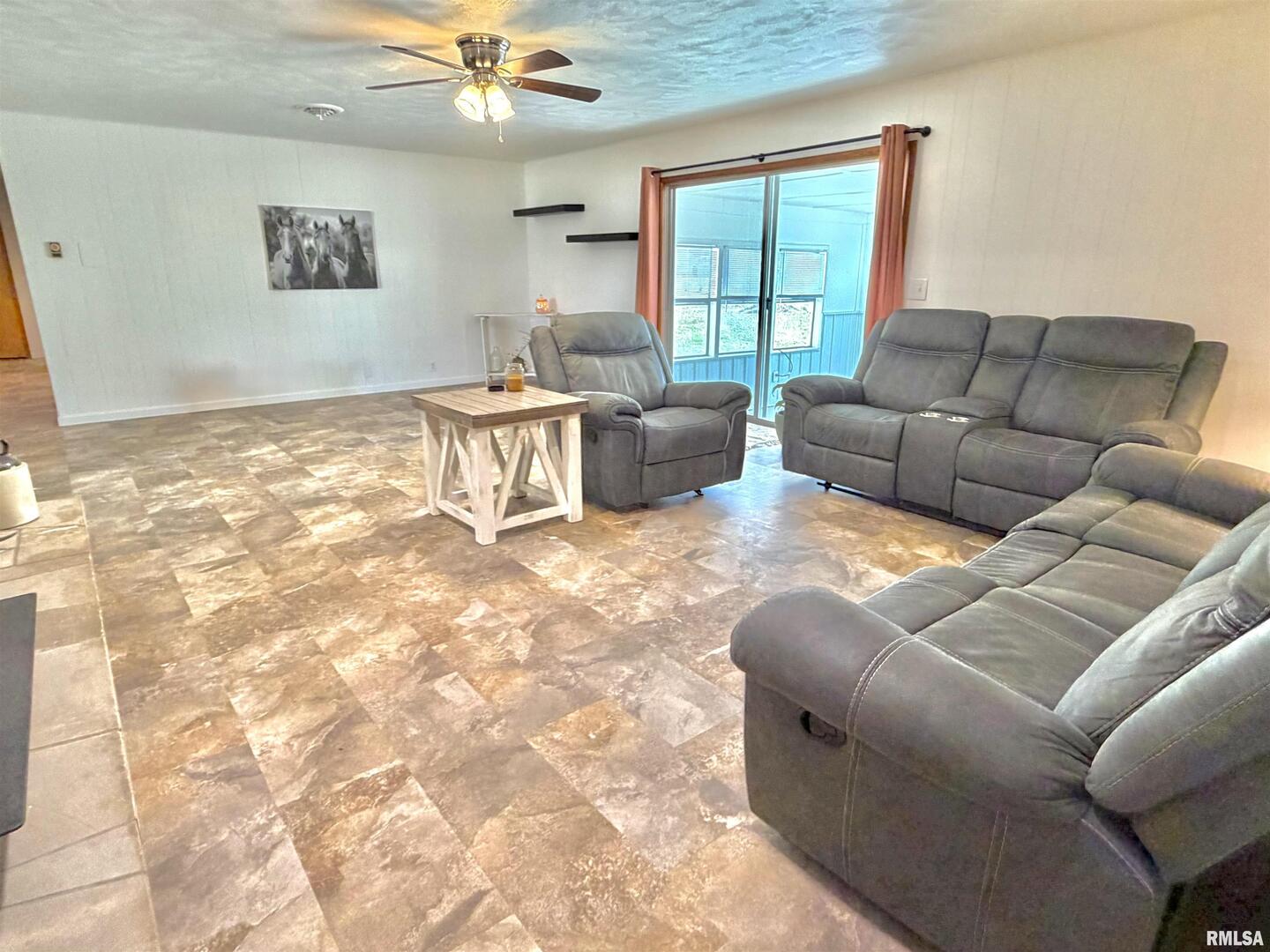 315 Hosselton Street Southwest Clay City, IL 62824 - Photo 15 of 70 a living room with furniture and a window