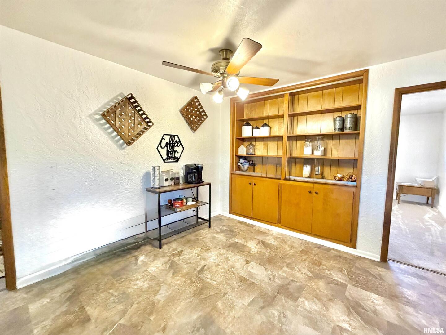 315 Hosselton Street Southwest Clay City, IL 62824 - Photo 18 of 70 a view of a bedroom with cabinet and a ceiling fan