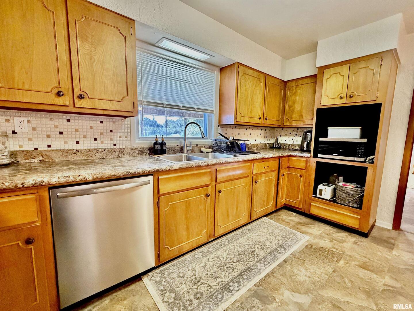 315 Hosselton Street Southwest Clay City, IL 62824 - Photo 20 of 70 a kitchen with stainless steel appliances granite countertop a sink stove and cabinets