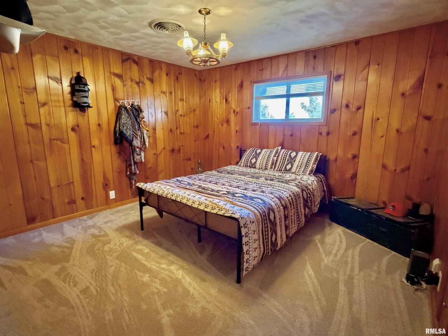 315 Hosselton Street Southwest Clay City, IL 62824 - Photo 23 of 70 a bedroom with a bed dresser and a window