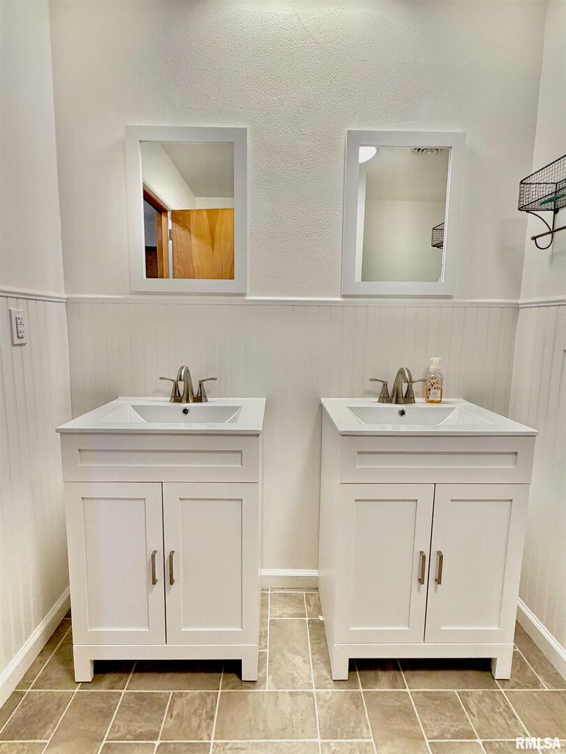 315 Hosselton Street Southwest Clay City, IL 62824 - Photo 26 of 70 a bathroom with a sink vanity and a mirror