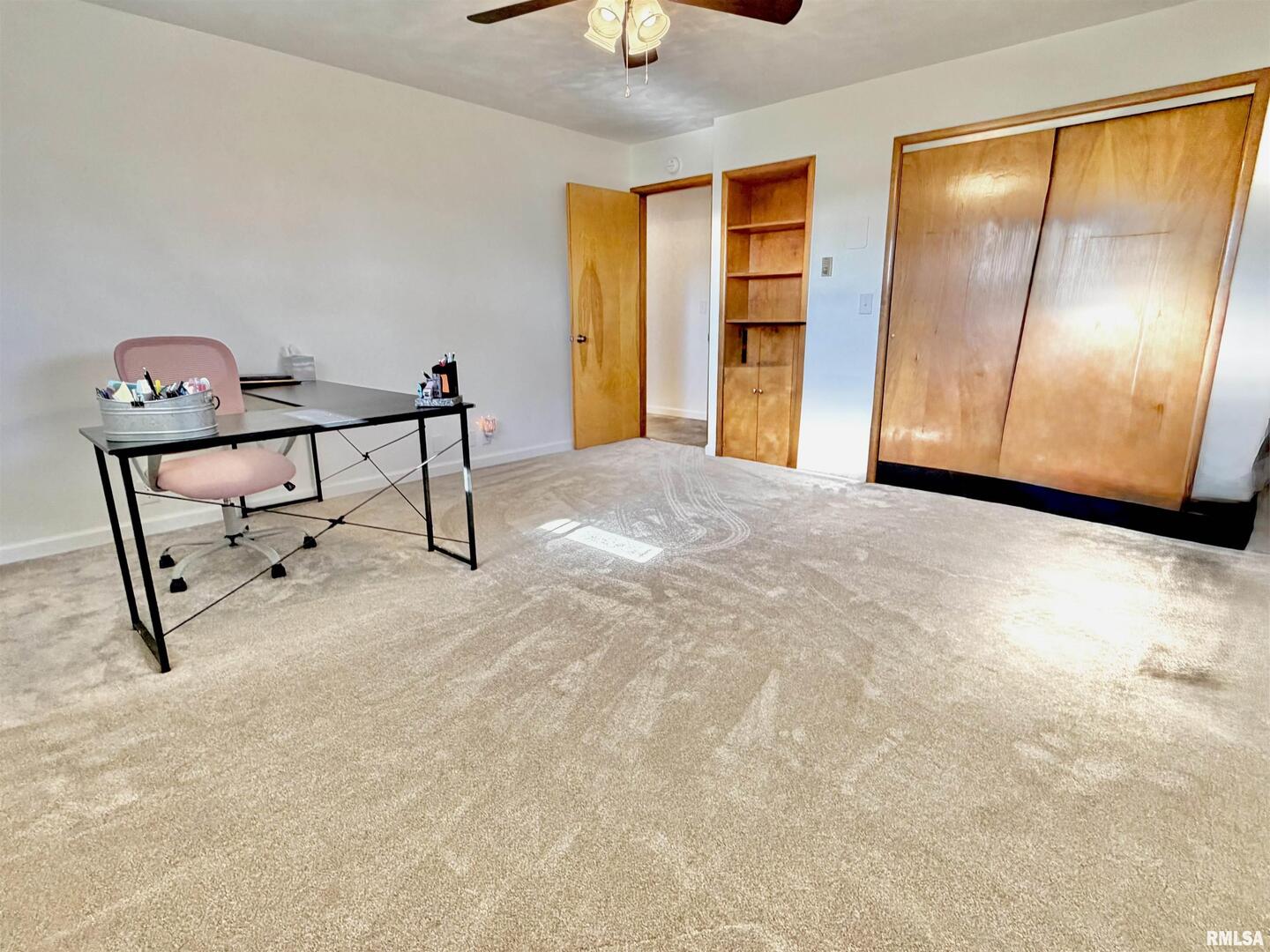 315 Hosselton Street Southwest Clay City, IL 62824 - Photo 34 of 70 a view of an empty room with window and stairs
