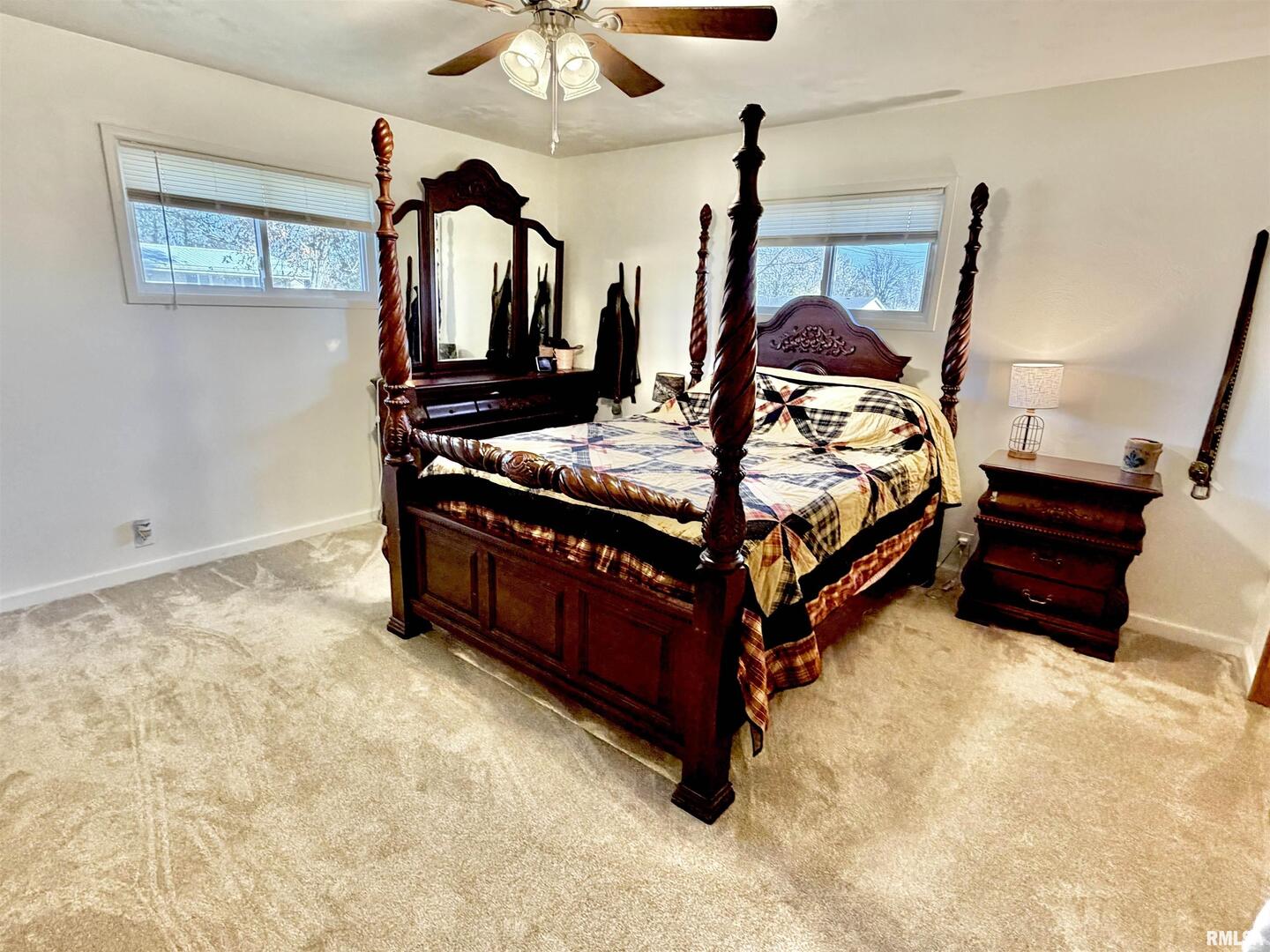 315 Hosselton Street Southwest Clay City, IL 62824 - Photo 35 of 70 a bed sitting in a room next to a lamp