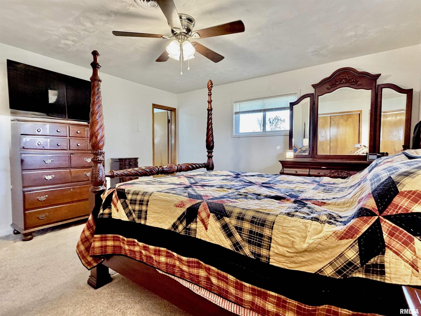 315 Hosselton Street Southwest Clay City, IL 62824 - Photo 36 of 70 a bedroom with a bed and flat screen tv