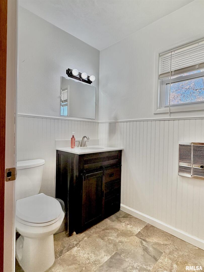 315 Hosselton Street Southwest Clay City, IL 62824 - Photo 42 of 70 a bathroom with a sink and a toilet