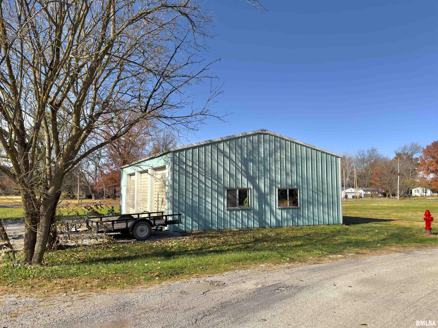 315 Hosselton Street Southwest Clay City, IL 62824 - Photo 56 of 70 a sign on the side of the road