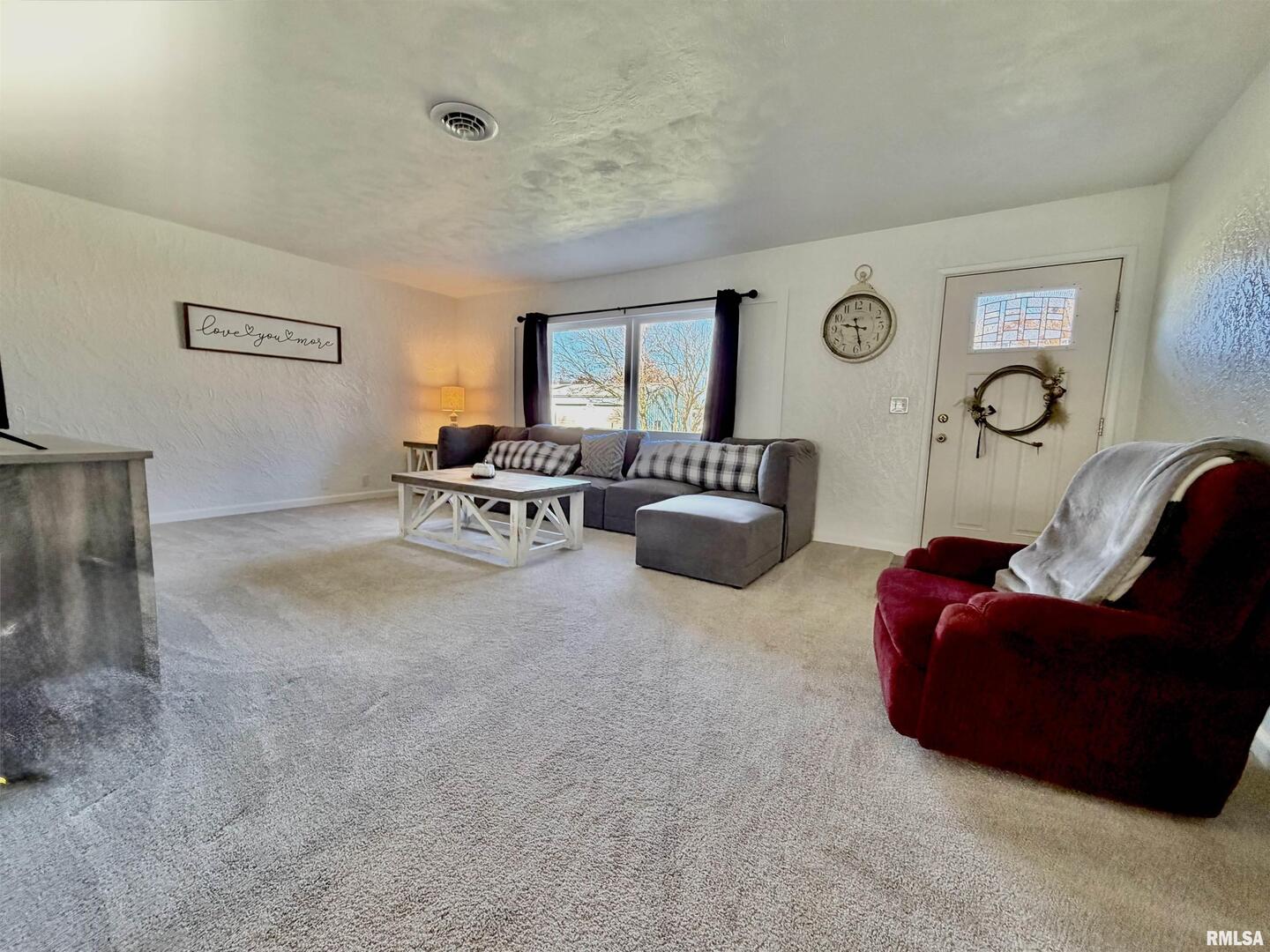 315 Hosselton Street Southwest Clay City, IL 62824 - Photo 6 of 70 a living room with furniture and a large window