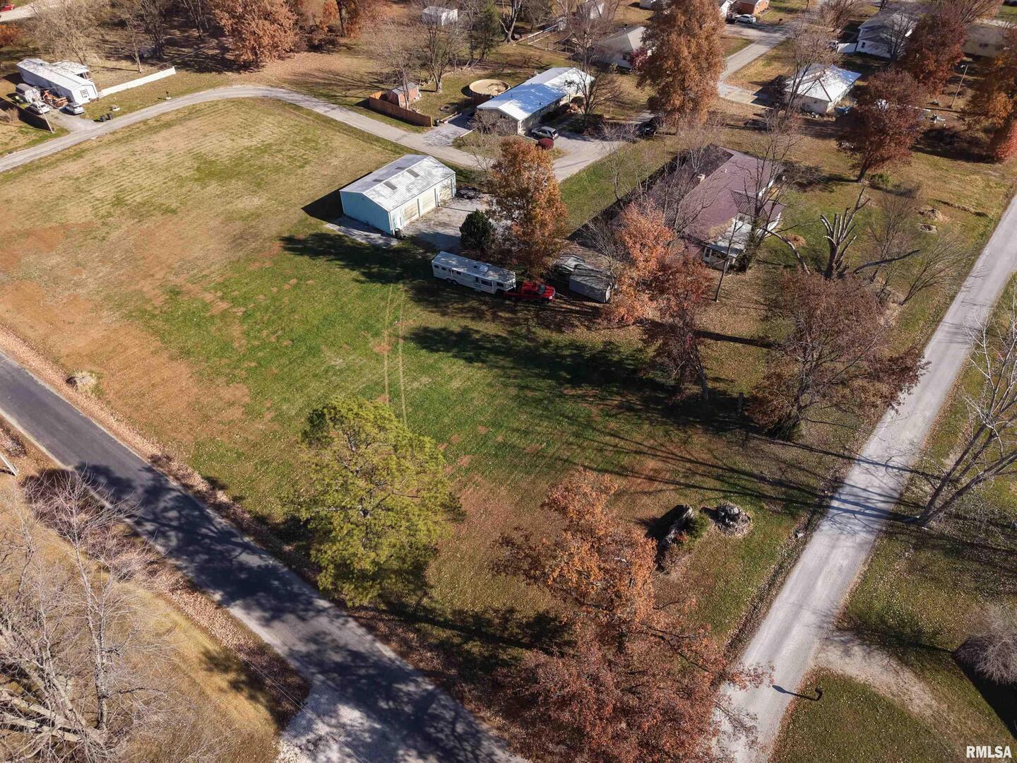 315 Hosselton Street Southwest Clay City, IL 62824 - Photo 70 of 70 a aerial view of a house with a yard