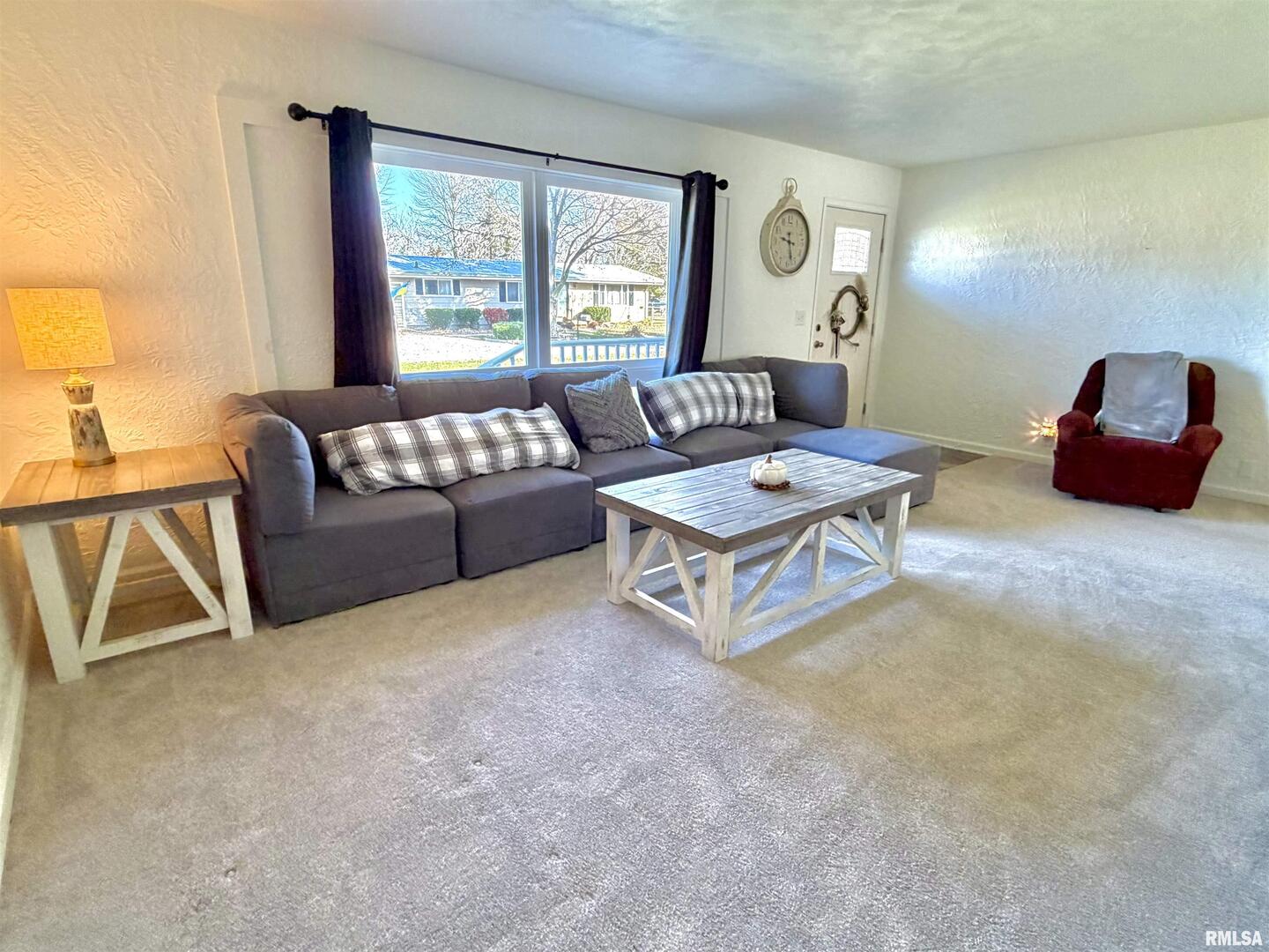 315 Hosselton Street Southwest Clay City, IL 62824 - Photo 10 of 70 a living room with furniture and a large window