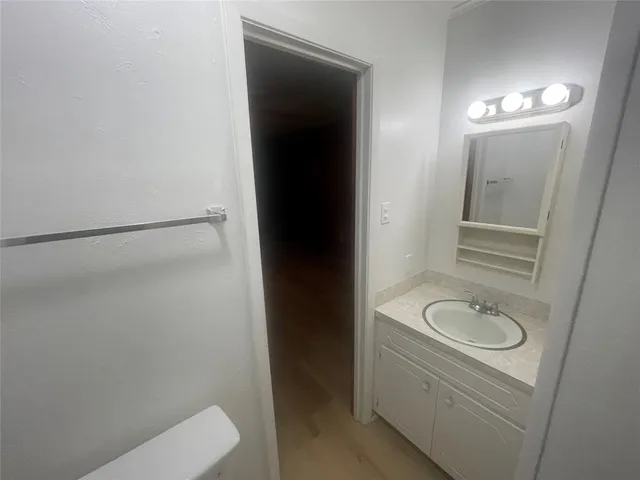 a bathroom with a sink and mirror