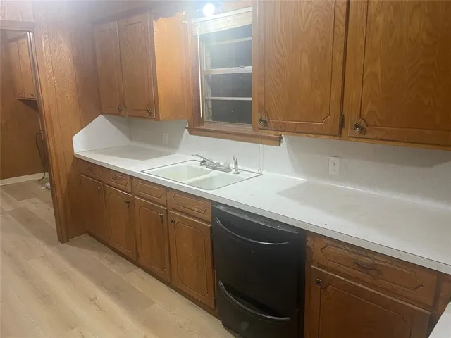 a stove top oven sitting inside of a kitchen