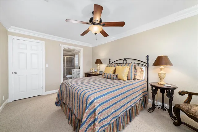 a bathroom with a double vanity sink toilet and shower