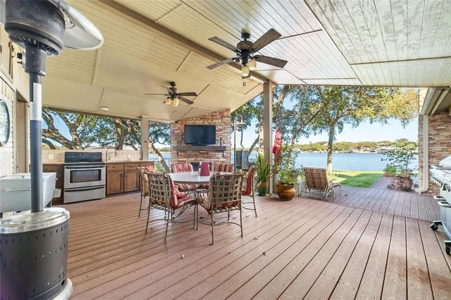 a view of a dining room with wooden floor outdoor seating and nature