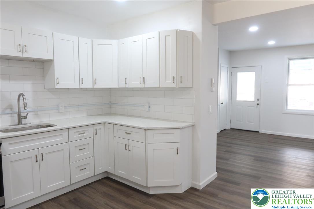 752 2nd Street Catasauqua, PA 18032 - Photo 7 of 23 a kitchen with white cabinets appliances and a sink