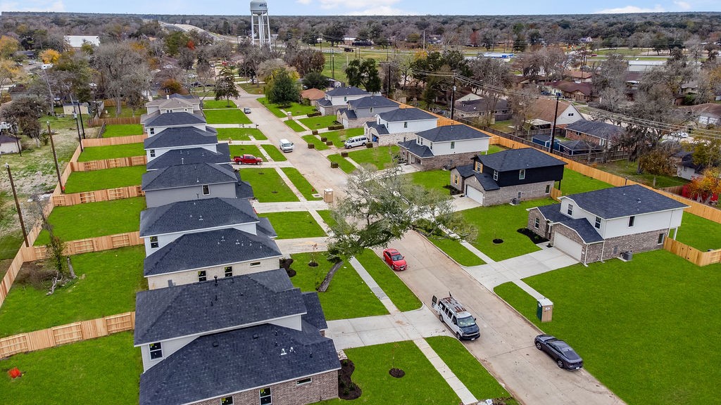 403 Magnolia Lane Richwood, TX 77531 - Photo 2 of 21 an aerial view of multiple houses with yard