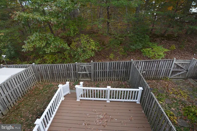 a view of balcony with wooden floor