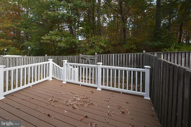 a view of balcony with wooden floor
