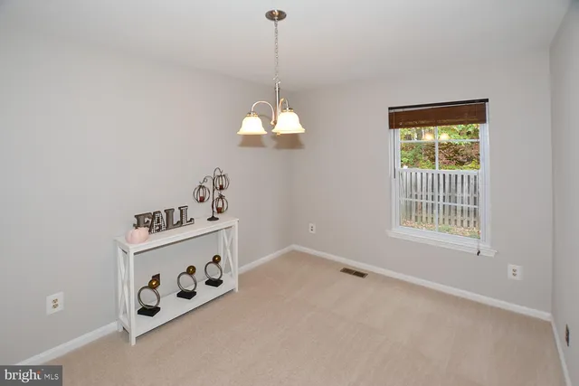 a room with window and ceiling fan