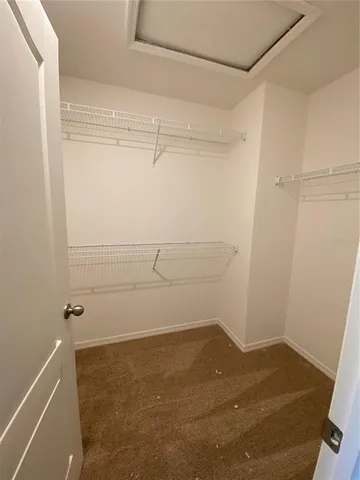 a view of a room with racks on the wall