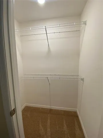 a bathroom with a sink a large mirror and a shower