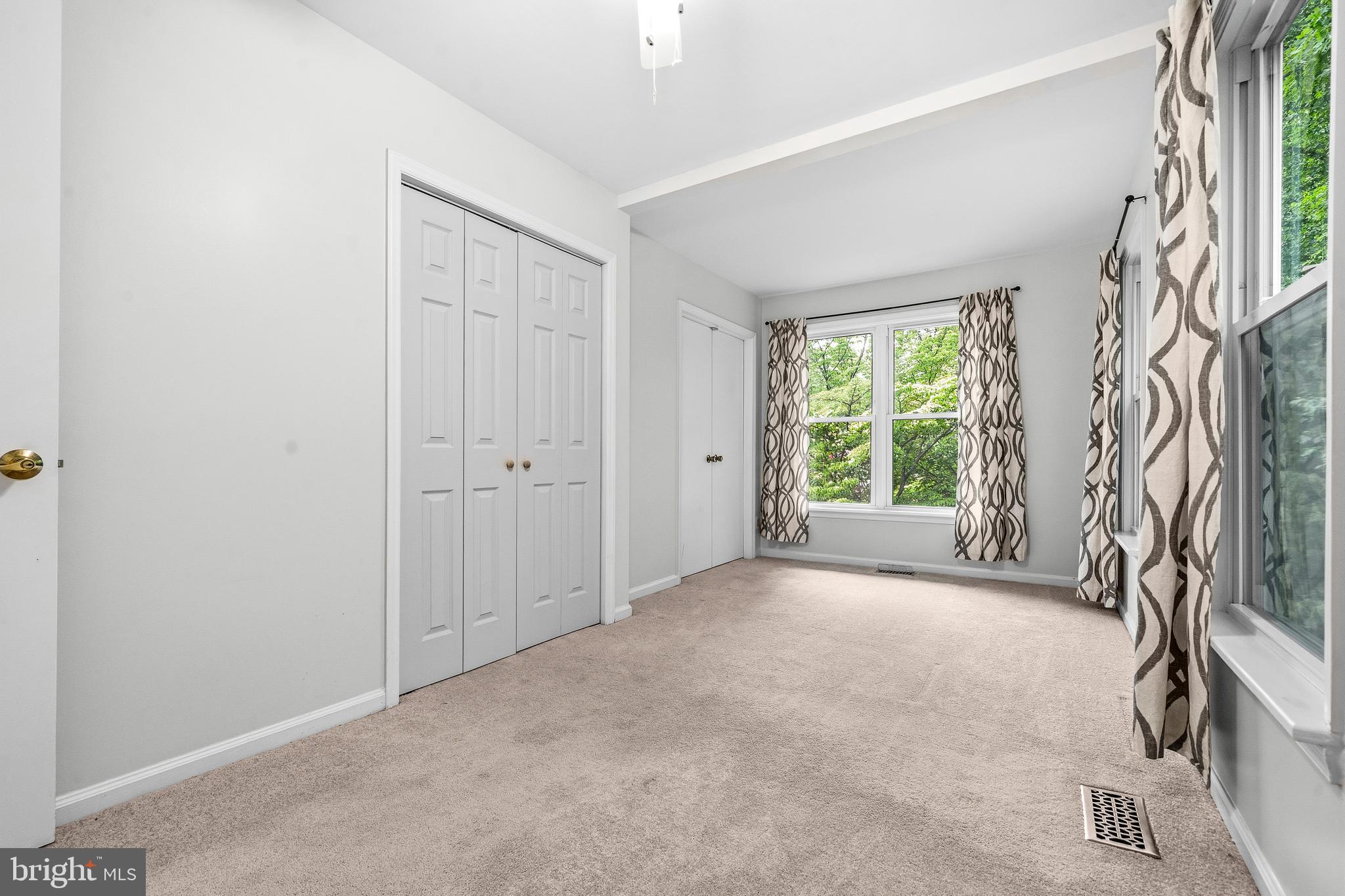 6001 Rabbit Hill Court Centreville, VA 20121 - Photo 25 of 46 an empty room with windows and a fireplace