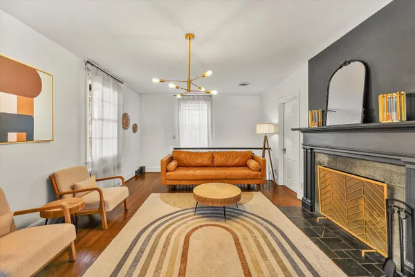 a living room with furniture and a fireplace