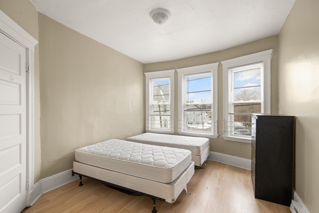 136 Franklin Street Lynn, MA 01902 - Photo 19 of 33 a bedroom with a bed and a large window