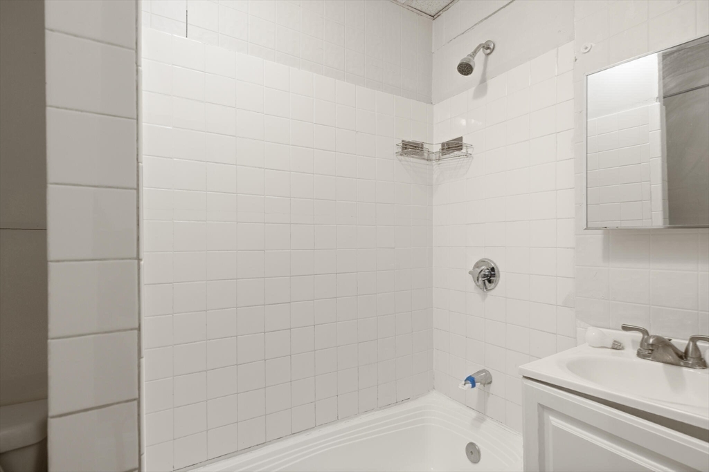 136 Franklin Street Lynn, MA 01902 - Photo 20 of 33 a bathroom with a bathtub and a sink