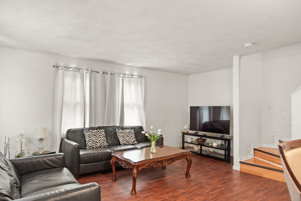 136 Franklin Street Lynn, MA 01902 - Photo 22 of 33 a living room with furniture and a flat screen tv