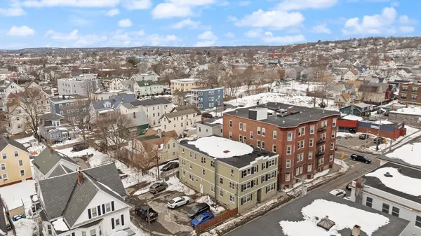 an aerial view of residential building with parking space