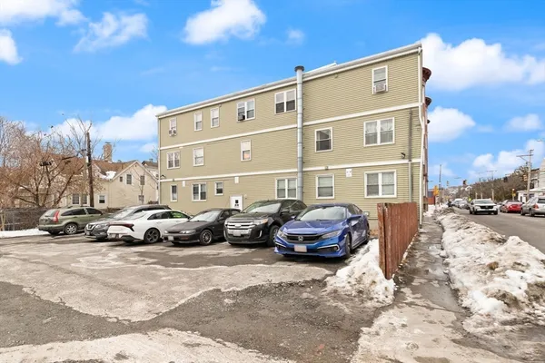 a view of a car park in front of a building