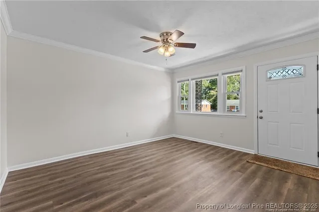 a view of a big room with wooden floor closet and windows