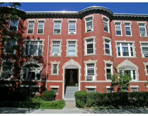 5 Strathmore Road Brookline, MA 02445 - Photo 1 of 1 a front view of a residential apartment building with a yard