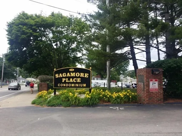 a street sign that is sitting in front of a house