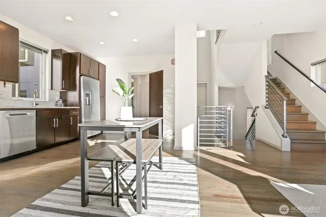 a view of a dining room with furniture window and wooden floor