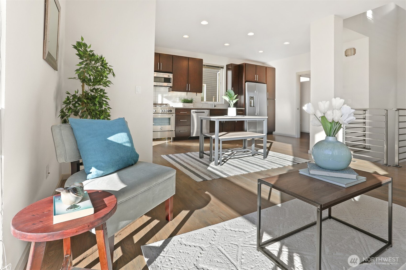 2426B Northwest 64th Street Seattle, WA 98107 - Photo 16 of 38 a living room with furniture kitchen and a potted plant