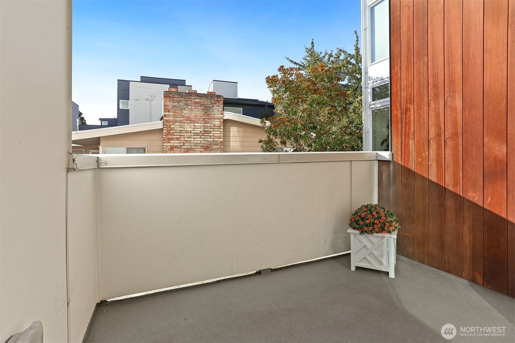 2426B Northwest 64th Street Seattle, WA 98107 - Photo 17 of 38 a view of a room with a window and chair