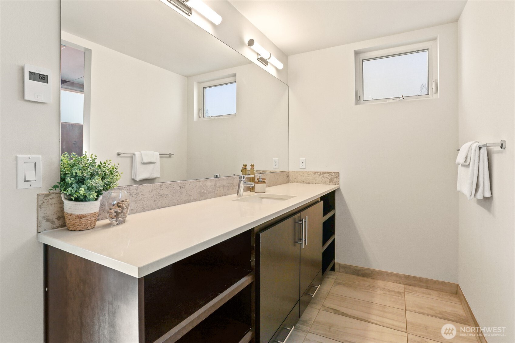2426B Northwest 64th Street Seattle, WA 98107 - Photo 21 of 38 a bathroom with a sink and a mirror