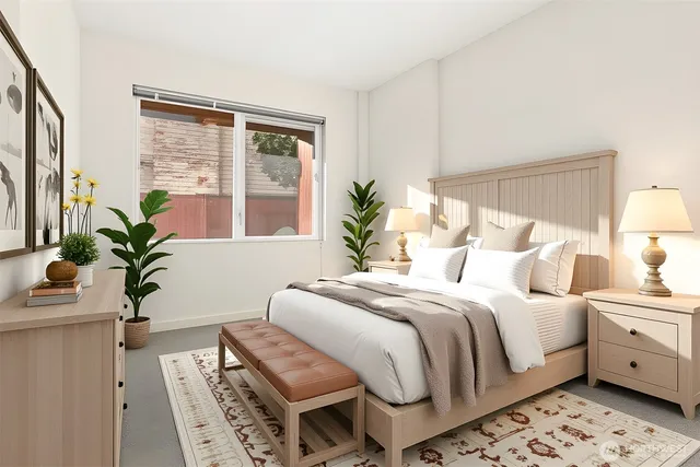 a bedroom with a bed and a potted plant