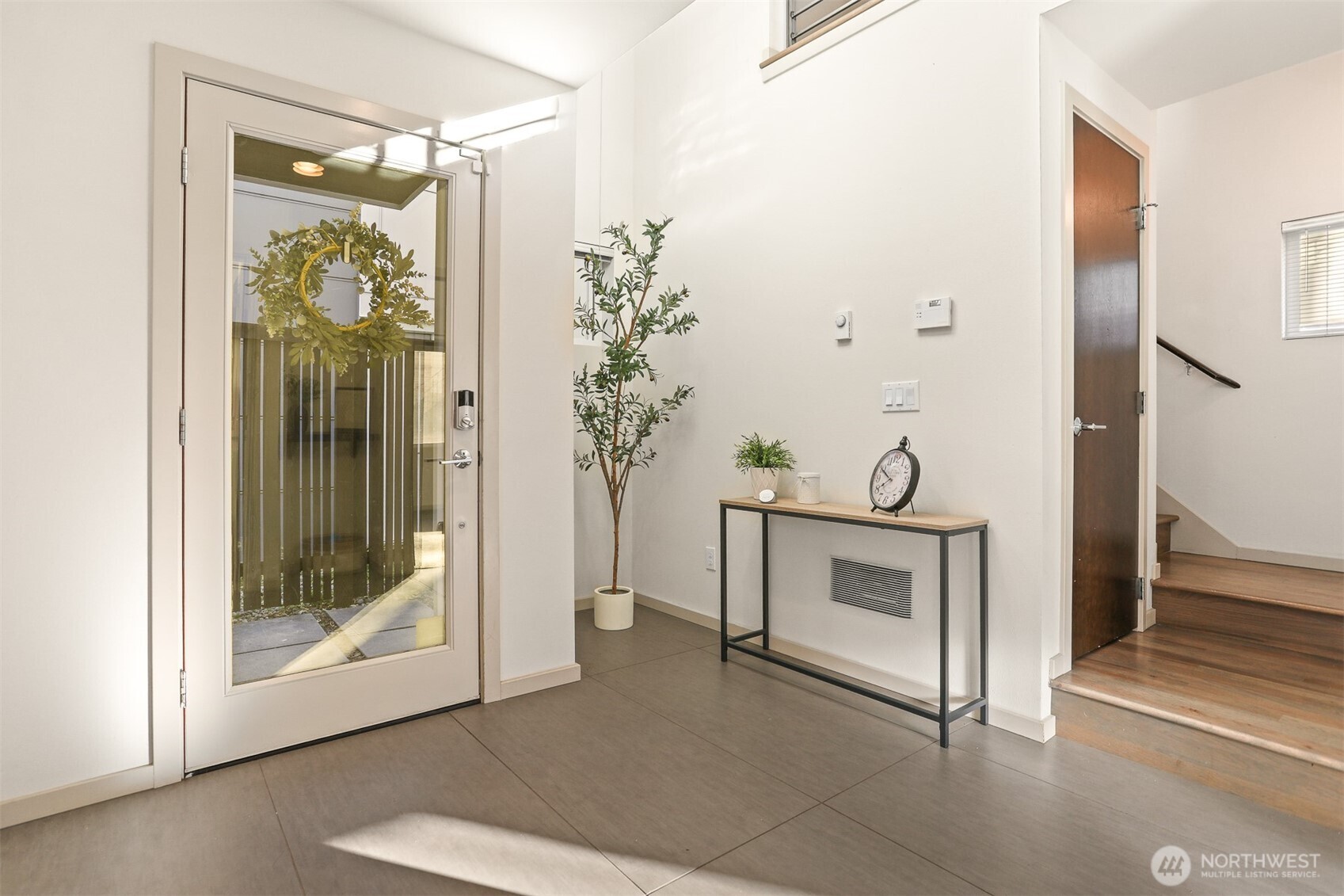 2426B Northwest 64th Street Seattle, WA 98107 - Photo 3 of 38 a view of an entryway and wooden floor