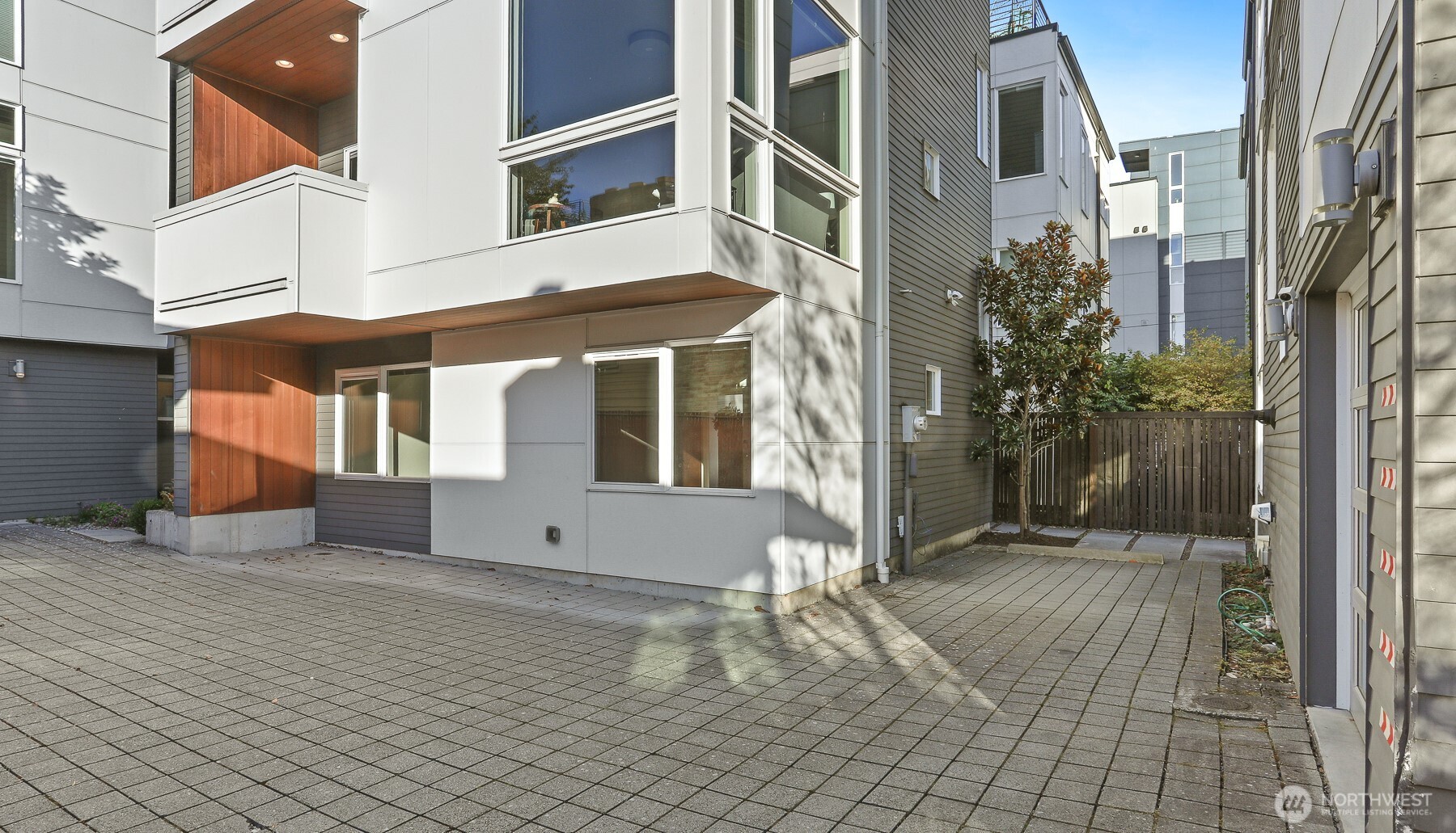 2426B Northwest 64th Street Seattle, WA 98107 - Photo 34 of 38 a view of a building with many windows