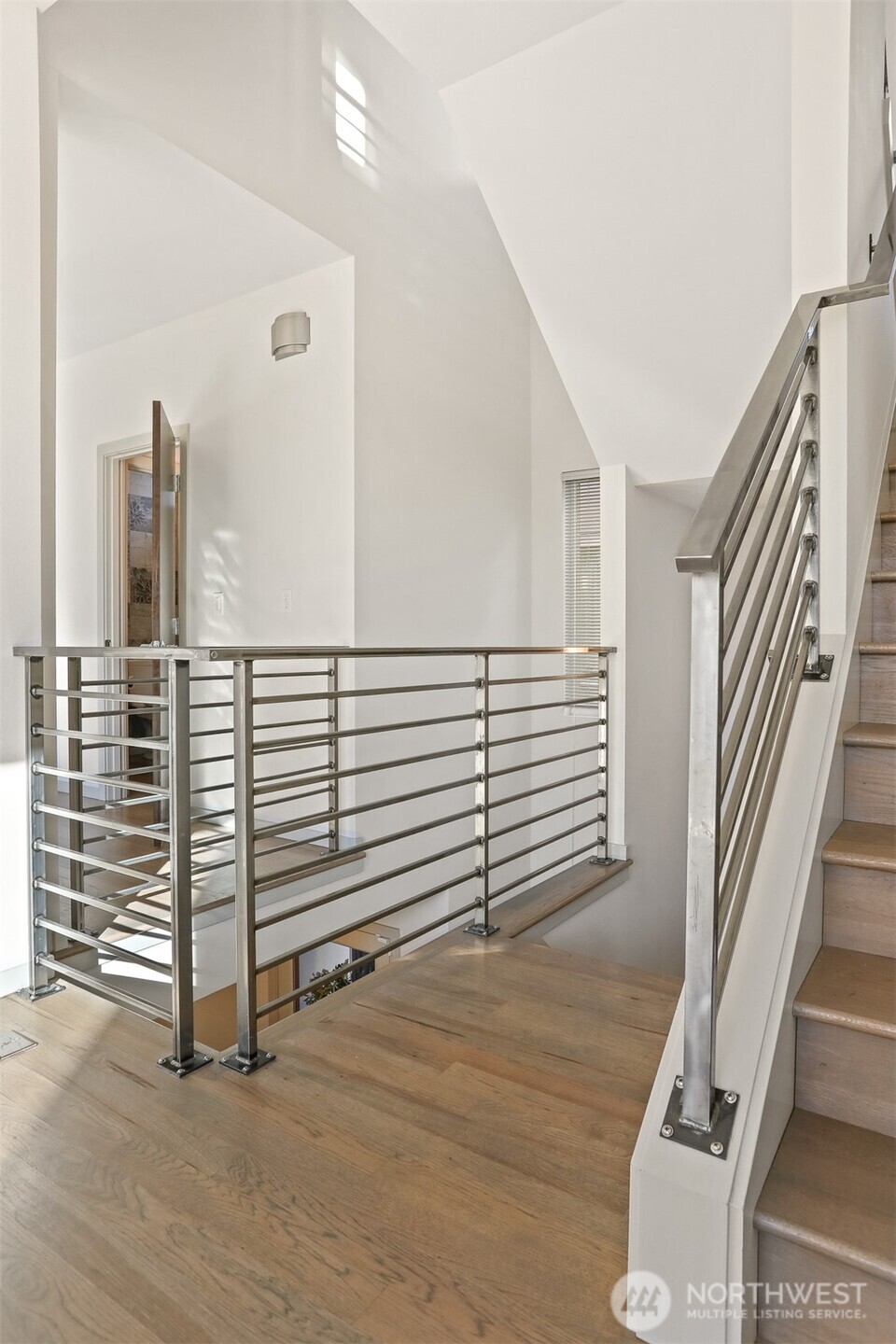 2426B Northwest 64th Street Seattle, WA 98107 - Photo 35 of 38 a view of a hallway with stairs and a couch