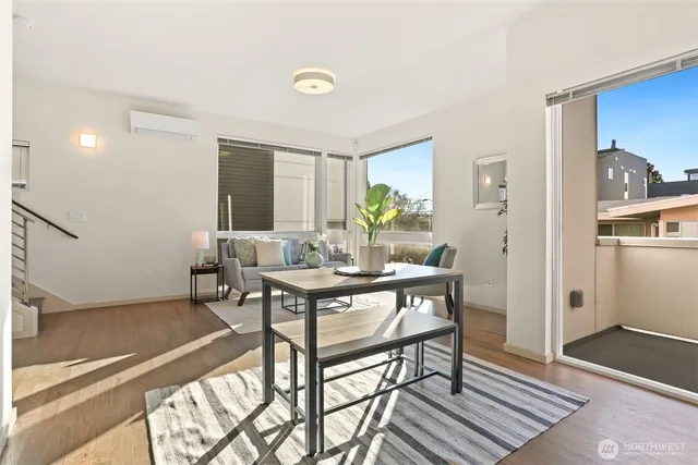 a view of a dining room with furniture and window