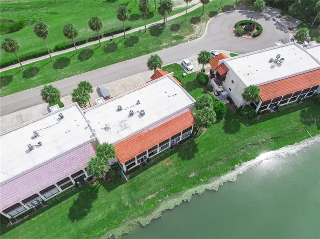 an aerial view of a house with a yard