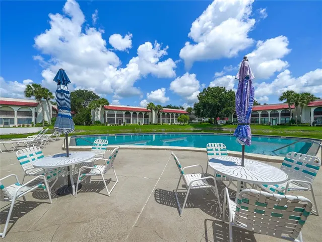 a table and chairs in a garden