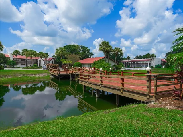 a view of a garden with sitting area