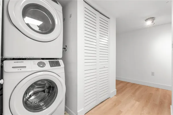 a view of a hallway with washer and dryer