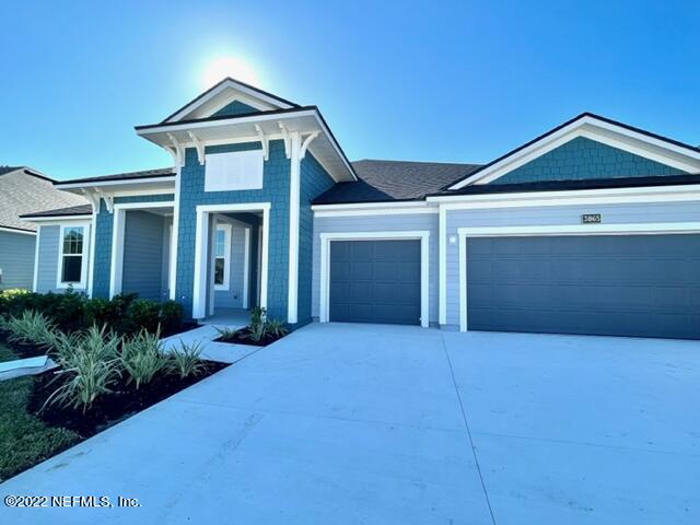 3865 Eagle Rock Road Middleburg, FL 32068 - Photo 1 of 7 a front view of a house with garden