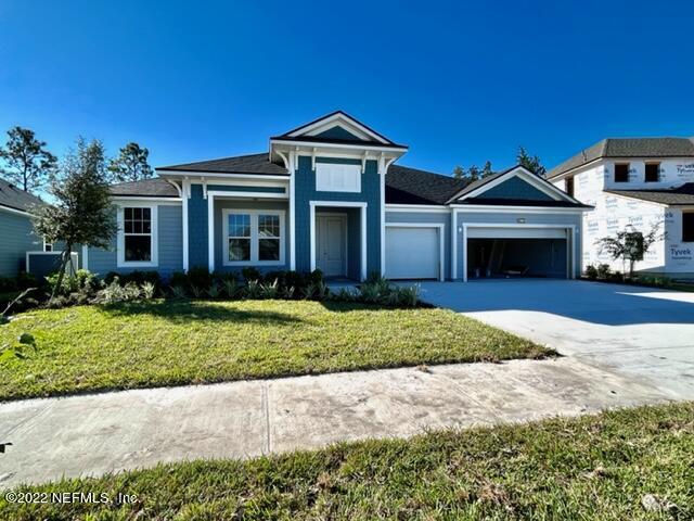 3865 Eagle Rock Road Middleburg, FL 32068 - Photo 2 of 7 a front view of a house with a garden and yard