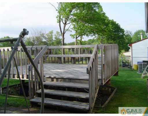 19 Georgetown Road Old Bridge, NJ 08859 - Photo 7 of 8 a view of house with backyard and deck